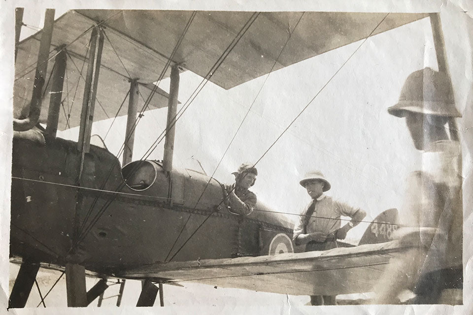 Jack Tusting photographed in Mesopotamia with his fighter plane in the first world war